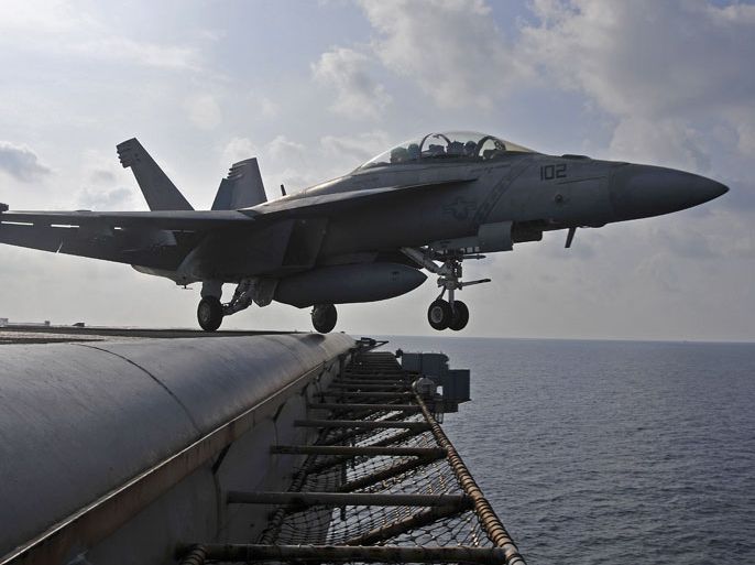 epa03439572 A handout photo released by the US Navy shows a F/A-18F Super Hornet, from the Diamondbacks of Strike Fighter Squadron (VFA) 102, launching from the aircraft carrier USS George Washington (CVN 73) during flight operations in the South China Sea on 15 October 2012. The nuclear-powered USS George Washington aircraft carrier leads the Carrier Strike Group, the US Navy's only continuously forward-deployed carrier strike group, based out of Yokosuka, Japan, and is currently conducting a routine western Pacific patrol in support of regional security and stability of the vital Asia-Pacific region. EPA/Brian H. Able