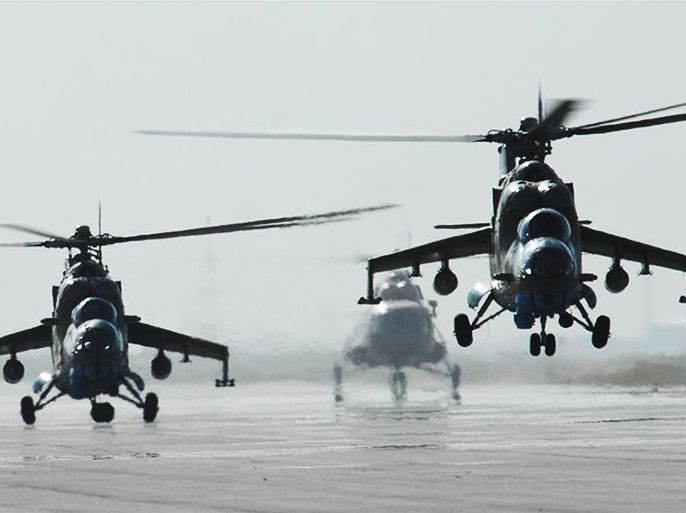 (FILES) In this picture provided by the US Coalition Forces on June 29, 2009 and taken on May 27, 2009, two MI-35 attack helicopters from the Afghan Army Air Corps launch for a gunnery training mission as another ANAAC MI-17 transport lands in the background at the Kabul International Airport. Afghanistan's air force is more like a bicycle than a fighting machine as US-led NATO forces prepare to withdraw from the war against Taliban Islamists, its commander said in an interview. Air power is crucial in the rugged country where the poor road network is often mined by the insurgents, and the Afghan government is pressing hard for the US to boost its airforce before pulling out next year. AFP PHOTO/ US COALITION FORCES/ Parker Gyokeres