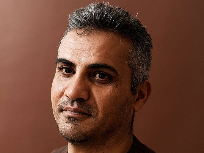 director Emad Burnat poses for a portrait during the 2012 Sundance Film Festival in Park City, Utah. Oscar-nominated Palestinian director Emad Burnat complained February 20, 2013 that US customs briefly held him as he arrived for the awards, but said his people endure similar problems every day. Burnat, whose "Five Broken Cameras