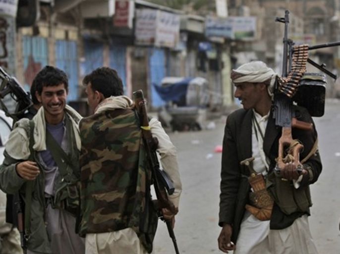 Hani Mohammed/AP - Armed tribesmen, loyal to Sheik Sadeq al-Ahmar, the head of the powerful Hashid tribe, guard a street around al-Ahmar's house in Sanaa, Yemen, on June 12, 2011. المصدر أسوشيتدبرس