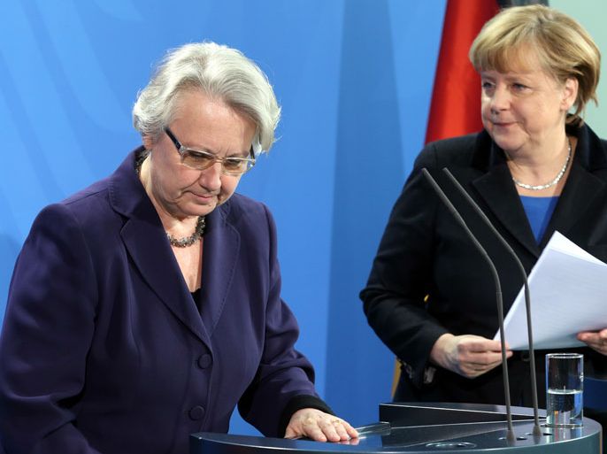 epa03575023 German Education and Research Minister Annette Schavan (L) along with German Chancellor Angela Merkel (R) give a statement to the media to announce Schavan's resignation, at the chancellery in Berlin, Germany, 09 February 2013. Germany's embattled Education and Science Minister Annette Schavan resigned 09 February over a plagiarism scandal, dealing an election-year blow to Angela Merkel's government. A university panel 07 February found the Christian Democratic Union (CDU) minister guilty of 'deliberate deception' for using foreign text passages without proper citation in her 33-year-old thesis. Chancellor Merkel in the joint news conference with Schavan said she had accepted her resignation 'with a heavy heart' and praised the minister's achievements in her 17-year political career. EPA/WOLFGANG KUMM