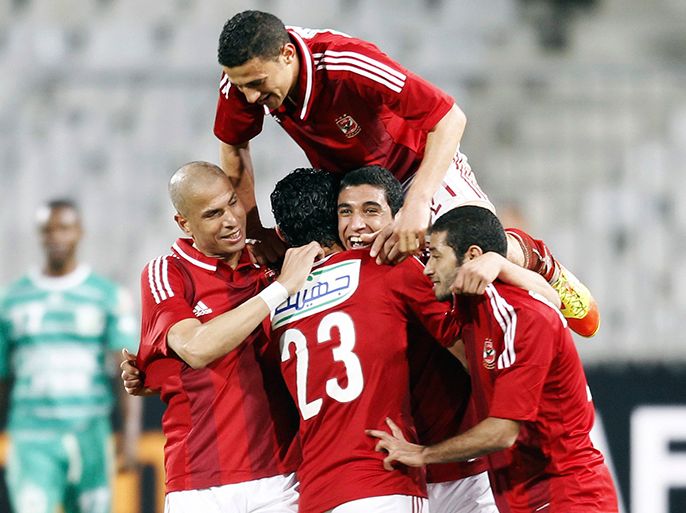 Rami Rabeia (C) of Egypt's Al-Ahly celebrates with team mates after scoring against Congo's Leopards during their Confederation of African Football (CAF) Super Cup soccer match at the Borg El Arab Stadium, west of the Mediterranean city of Alexandria, 230 km (143 miles) north of Cairo February 23, 2013. REUTERS/Amr Abdallah Dalsh (EGYPT - Tags: SPORT SOCCER)