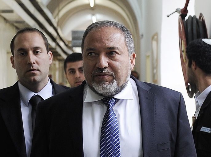 Former Israeli foreign minister Avigdor Lieberman arrives at Jerusalem Magistrate's Court for the opening of his trail in which he is facing charges of fraud and breach of trust on February 17, 2013. The opening hearing before a panel of three judges was to begin at 1200 GMT, with Lieberman expressing confidence that he will be cleared of all charges and will return to resume his job as foreign minister. AFP PHOTO/POOL DAVID BUIMOVITCH