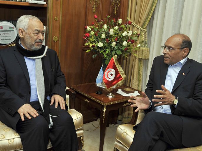 Ennahdha Islamist party leader Rached Ghannouchi meets with Tunisian President Moncef Marzouki (R) on February 20, 2013, at the Carthage palace in Tunis. Tunisian Prime Minister Hamadi Jebali said that he has submitted his resignation to President Marzouki, a day after his efforts to form a government of technocrats failed. AFP PHOTO / FETHI BELAID