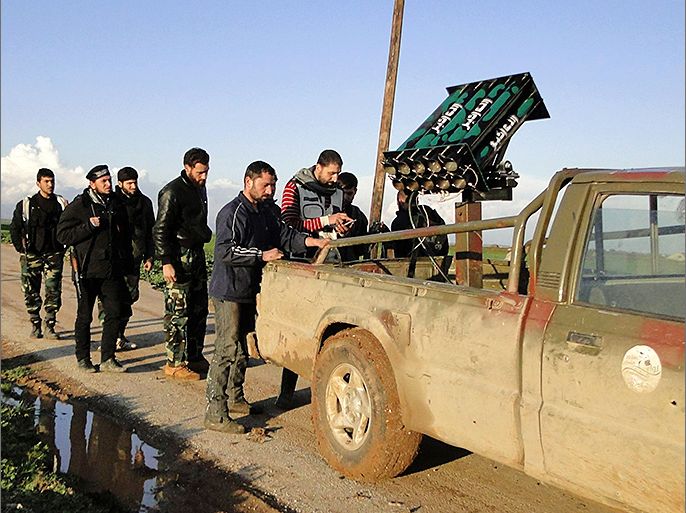 Free Syrian Army fighters stand beside a locally made anti-aircraft weapon near the Menagh military airport in Aleppo's countryside, February 17, 2013. REUTERS/Mahmoud Hassano (SYRIA - Tags: CONFLICT POLITICS CIVIL UNREST)