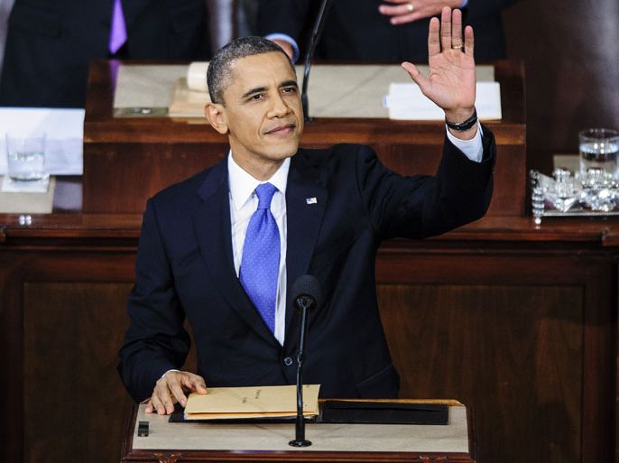 epa03581357 US President Barack Obama waves to spectators in the House Chamber before delivering his first State of the Union since winning re-election at the US Capitol in Washington, DC, USA, 12 February, 2013. EPA/PETE MAROVICH