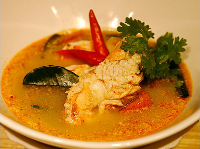 epa00888564 A bowl of Thailand's famous Tom Yam Goong or spicy shrimp soup at a restaurant in Bangkok, Thailand, Saturday 16 December 2006. Tom Yam Kung, the number one of the top ten Thai dishes loved by foreigners features a unique sour and spicy taste, and also includes medicinal properties in its herbal ingredients. Food in south east Asian nations is a varied, delicious mixed bag of fresh meat, fish and vegetables, combined in a spicy, sweet and sour array of mouth watering dishes. Many dishes are cooked on the street at food markets, and the same dishes served in high end restaurants. Everyone can afford to eat out at one or the other. EPA/RUNGROJ YONGRIT