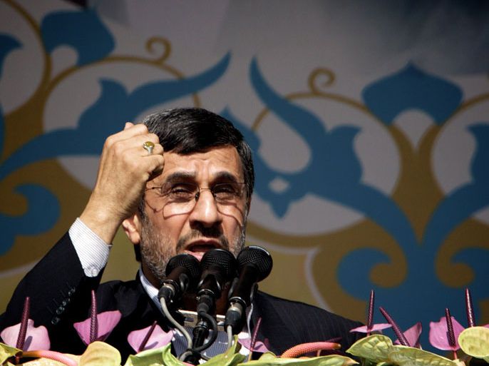 IRAN : Iranian President Mahmoud Ahmadinejad delivers a speech during a rally in Tehran's Azadi Square (Freedom Square) to mark the 34th anniversary of the Islamic revolution on February 10, 2013. Hundreds of thousands of people marched in Tehran and other cities chanting "Death to America" and "Death to Israel" as Iran celebrated the anniversary of the ousting of the US-backed shah. AFP PHOTO/BEHROUZ MEHRI