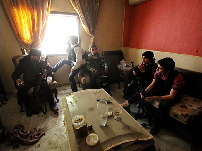 Free Syrian Army fighters inside a house in Aleppo last week. The United States has been helping Arab governments and Turkey send arms to the rebels.