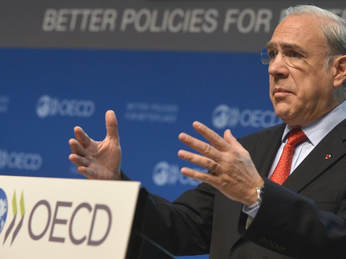 epa03487854 OECD Secretary General Jose Angel Gurria addresses the media during a press conference to present the OECD Economic Outlook at the OECD headquarters, in Paris, France, 27 November 2012. The organization has cut down its forecast for growth in the world’s advanced economies for 2013, and alerted of the risk of a serious global recession. OECD expects from its members a growth of 1.4 percent, down from 2.2 percent, for 2013. EPA/CHRISTOPHE KARABA
