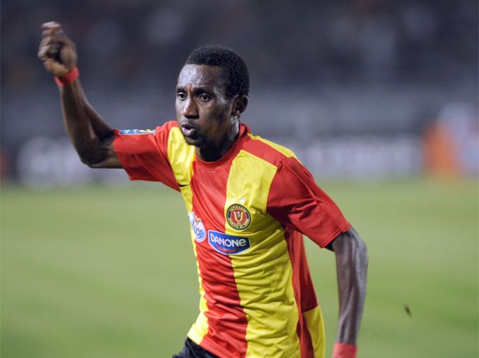 Esperance of Tunisia Harrison Afful celebrates after scoring against Wydad Casablanca of Morocco on November 12, 2011 during their Africa Champions league final football match at the Rades Olympic stadium in Tunis.