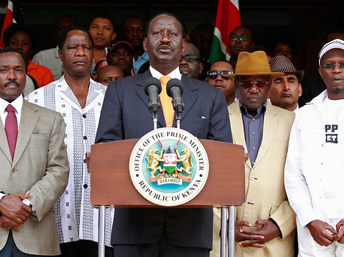 Kenya's Prime Minister Raila Odinga (C), flanked by members of the Coalition for Reforms and Democracy (CORD), addresses the media outside his office in the capital Nairobi, March 16, 2013. Kenya's defeated presidential contender Odinga filed a legal challenge to his election loss on Saturday in a major test of the country's democratic system five years after a disputed vote triggered deadly tribal clashes. REUTERS/Thomas Mukoya (KENYA - Tags: POLITICS ELECTIONS CRIME LAW)