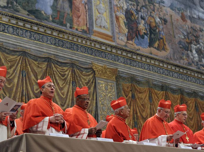 MLM294 - Vatican City, -, VATICAN CITY STATE : This handout picture released by the Press office shows cardinals chanting the Latin hymn "Veni Creator Spiritus" ("Come Creator Spirit") in the Sistine Chapel before the start of the conclave at the Vatican on March 12, 2013. Cardinals moved into the Vatican today as the suspense mounted ahead of a secret papal election with no clear frontrunner to steer the Catholic world through troubled waters after Benedict XVI's historic resignation. The 115 cardinal electors who pick the next leader of 1.2 billion Catholics in a conclave in the Sistine Chapel will live inside the Vatican walls completely cut off from the outside world until they have made their choice. AFP PHOTO/OSSERVATORE ROMANO