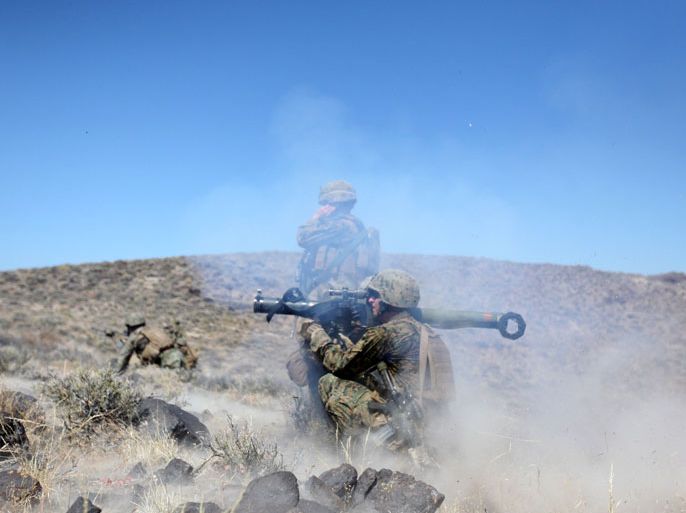 f_This handout image provided March 19, 2013 by US Marine Corps, shows Marines from 2nd Platoon, Charlie Company 1st Battalion, 1st Marine Regiment, 1st Marine Division firing a Shoulder-Launched Multipurpose Assault Weapon during platoon attacks as part of Exercise Mountain Warrior 06-10 at Hawthorne Army Depot,in Nevada on July 25, 2010.
