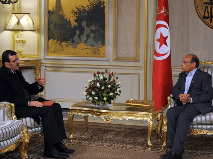 Tunisian President Moncef Marzouki (R) meets Prime Minister-designate Ali Larayedh following his meeting with leaders of local political parties on March 7, 2013 in Tunis. A deal on the composition of Tunisia's new government has been reached and will be presented on March 8, prime minister-designate Ali Larayedh said on March 7. AFP PHOTO / FETHI BELAID