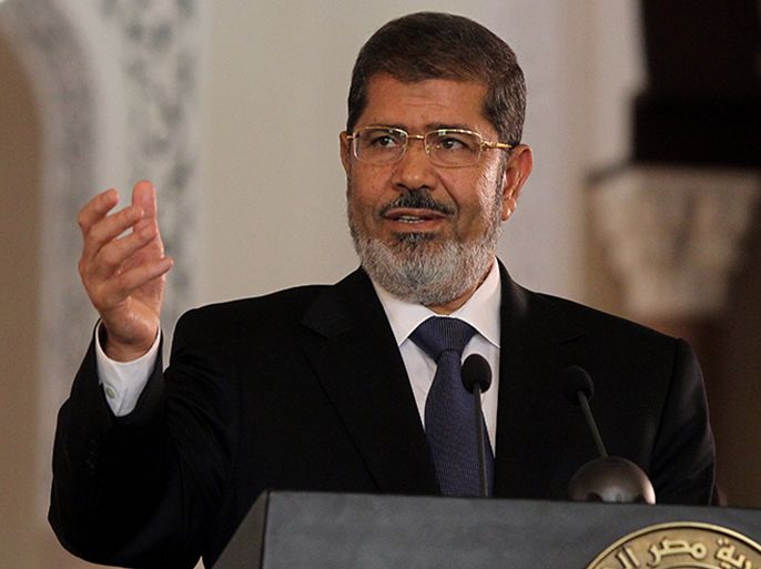 epa03305813 Egyptian President Mohamed Morsi speaks during a press conference with Tunisian President Moncef Marzouki (not pictured) at the presidential palace, in Cairo, Egypt, 13 July 2012. Marzouki is the first head of state to meet with Morsi in Cairo since he was sworn-in on 30 June 2012. Morsi on 12 July returned from a visit to Saudi Arabia during which he met with king Abdullah bin Abdul Aziz. EPA/KHALED ELFIQI