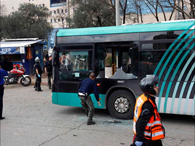 r_a damaged bus is seen at the scene of an explosion in jerusalem march 23, 2011. a bomb exploded near a bus in a jewish neighbourhood of jerusalem on wednesday, injuring (رويترز)