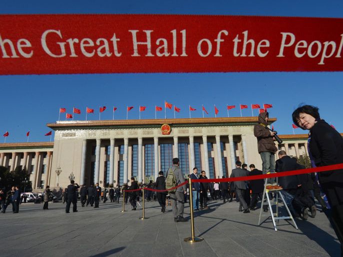 MRR2736 - Beijing, -, CHINA : Delegates arrive at the Great Hall of the People during the National People's Congress (NPC) in Beijing on March 10, 2013. Thousands of delegates from across China were meeting this week to seal a power transfer to new leaders whose first months running the Communist Party have pumped up expectations with a deluge of propaganda. AFP PHOTO/Mark RALSTON