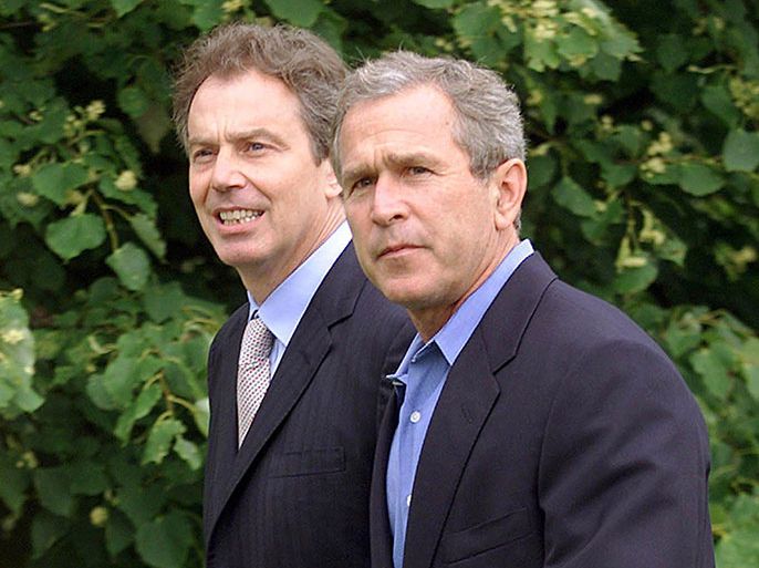 WENDOVER, UNITED KINGDOM : US President George W. Bush (R) walks with British Prime Minister Tony Blair (L) 19 July 2001 at Checquers (the Prime Minister's weekend compound) in Wendover, England. President Bush is scheduled to spend two nights in London before going to the G-8 Economic Summit in Genoa, Italy.