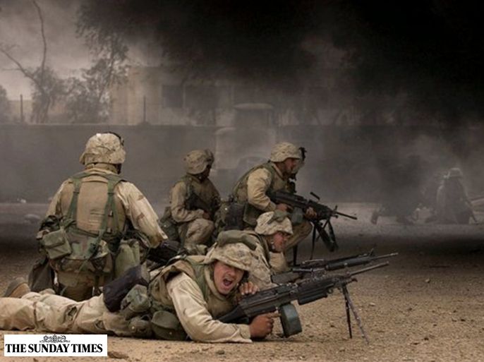 US marines advance on the Fedayeen’s headquarters in Baghdad in April 2003 Laura Rauch) the sunday times