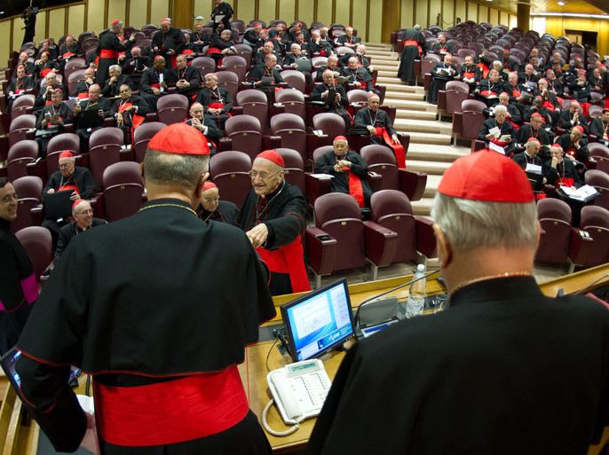 This handout picture released on March 4, 2013 by the Vatican press office shows Cardinals Angelo Sodano (R) and cardinal chamberlain Tarcisio Bertone (L) opening talks ahead of a conclave to elect a new pope after Benedict XVI's resignation, as an absent British cardinal admitted to sexual misconduct with priests. The Vatican meetings will set the date for the start of the conclave this month and help identify candidates among the cardinals to be the next leader of the world's 1.2 billion Catholics