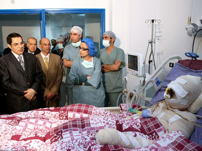 A photograph made available on 05 January 2011 shows Tunisian President Zine El-Abidine Ben Ali (L) paying a visit to Mohamed Al Bouazzizi (R), the protester who set himself alight on 17 December in a protest against unemployment, at a hospital in Ben Arous near Tunis, Tunisia, 28 December 2010. According to media sources on 05 January 2011, Bouazizi died at the hospital of the injuries he sustained when setting himself alight on 17 December. His suicide attempt had triggered a wave of protests and riots