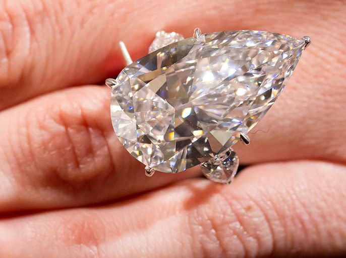 An employee shows a diamond ring, 21.88 carat, with an estimated value of 1.75 to 2.85 million US dollars at Sotheby's auction house in Zurich, Switzerland, 02 May 2012. The auction of several pieces of jewelry will take place in Geneva on 15 May. EPA/ALESSANDRO DELLA BELLA