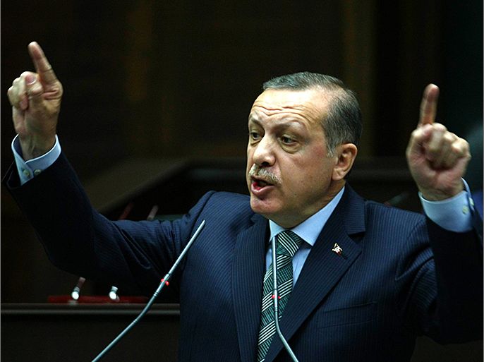 Turkish Prime Minister Recep Tayyip Erdogan addresses deputies on March 19, 2013 at the parliament in Ankara. AFP PHOTO/ADEM ALTAN