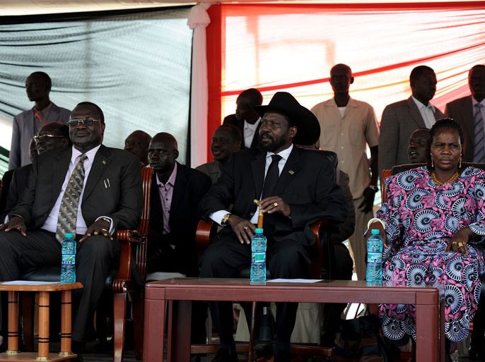Caption:South Sudan's President Salva Kiir (C) with his wife Ayendit (R) and South Sudan's Vice President Riek Machar (L) listen during the announcement of the results of the voting in Sudan, January 30, 2011. South Sudan overwhelmingly voted to split from the north in a referendum intended to end decades of civil war, officials said on Sunday, sparking mass celebrations in the southern capital Juba.
