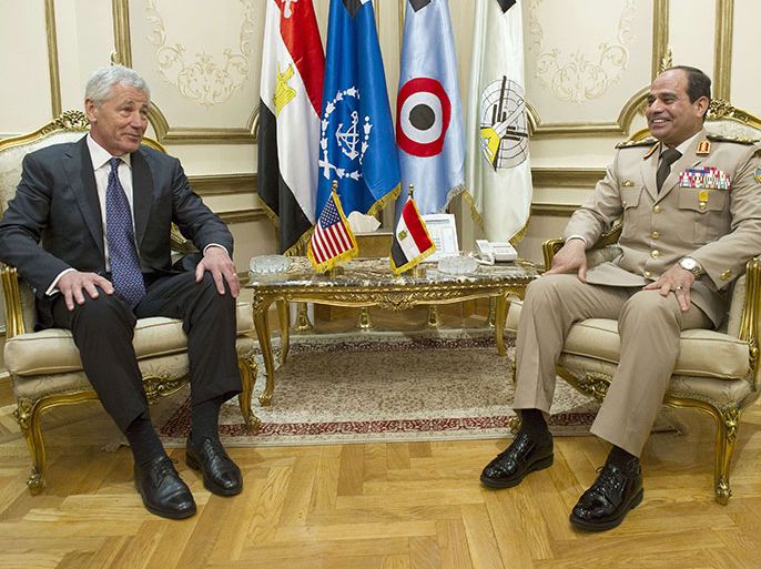 US Secretary of Defense Chuck Hagel (L) meets with Egyptian Defence Minister General Abdel Fattah al-Sissi at the Ministry of Defense in Cairo, on April 24, 2013. Hagel landed in Egypt as part of a Middle East tour designed to bolster America's alliances amid growing concern over the fallout from Syria's roiling civil war. AFP PHOTO/POOL/JIM WATSON