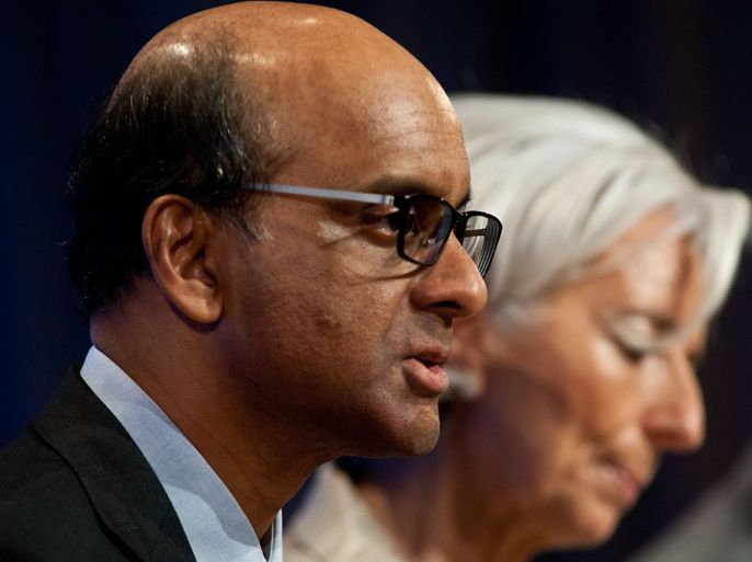 NK040 - Washington, District of Columbia, UNITED STATES : International Monetary and Financial Committere (IMFC) chair Tharman Shanmugaratnam and International Monetary Fund (IMF) Managing Director Christine Lagarde speak at a press conference after the IMFC meeting at the 2013 World Bank/IMF Spring meetings in Washington on April 20, 2013. AFP PHOTO/Nicholas KAMM