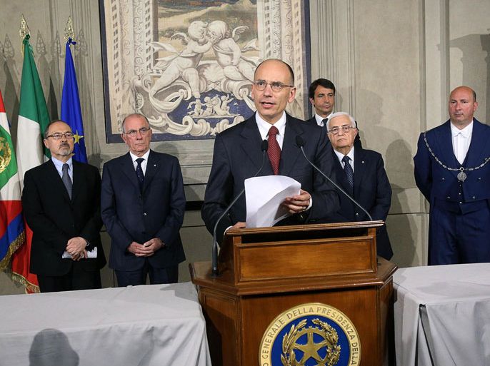 epa03678997 Italian Prime Minister Delegate Enrico Letta (C) announces his cabinet list after a meeting with Italian President Giorgio Napolitano at the Quirinale Palace in Rome, Italy, 27 April 2013. Letta formally accepted the job of Italian prime minister and submitted his cabinet list to President Giorgio Napolitano. The instalment of a new government will formally end weeks of political stalemate after February's inconclusive elections. EPA/ALESSANDRO DI MEO
