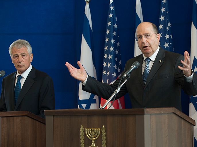 US Defence Secretary Chuck Hagel listens to Israeli Minister of Defense Moshe Yaalon (R) speaking during a joint press conference following a meeting at the Ministry of Defense on April 22, 2013 in Tel Aviv, Israel. Hagel meets his Israeli counterpart for talks expected to focus on Syria's protracted civil war and Iran's disputed nuclear programme. AFP PHOTO/POOL/JIM WATSON