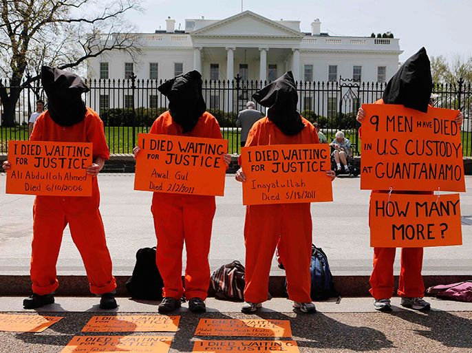 Activists rally in front of the White House demanding U.S. President Barack Obama to close down the U.S. prison in Guantanamo Bay while in Washington, April 11, 2013. REUTERS/Larry Downing (UNITED STATES - Tags: POLITICS CIVIL UNREST)