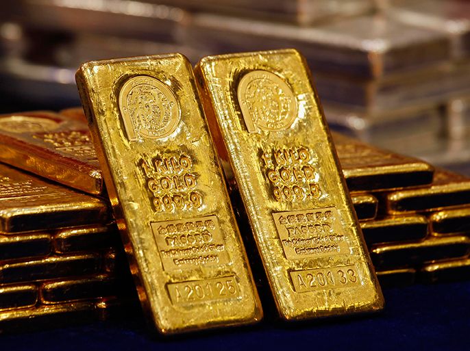 One-kg 24K gold bars are displayed at the Chinese Gold and Silver Exchange Society, Hong Kong's major gold and silver exchange, during the first trading day after the Chinese New Year holidays, in Hong Kong in this February 14, 2013 file photo. Gold fell below $1,500 per ounce on April 12, 2013, a drop of more than 20 percent from its record 2011 highs, putting it in bear market territory for the first time since May 2012. REUTERS/Bobby Yip/Files (CHINA - Tags: BUSINESS COMMODITIES)