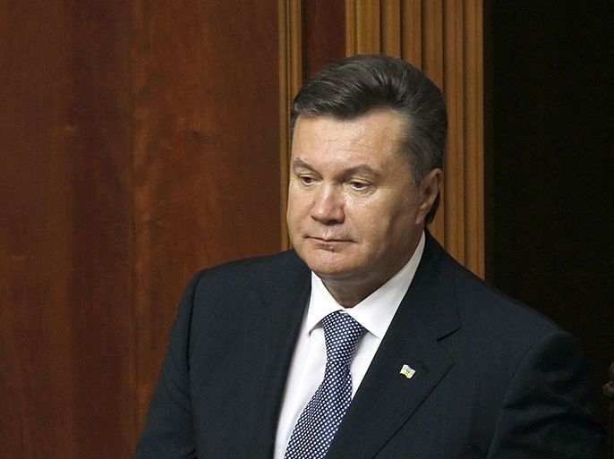 epa02901367 Ukrainian President Viktor Yanukovych arrives for the opening ceremony of a new session of parliament in Kiev, Ukraine, 06 September 2011. Parliament members of opposition's bloc left the session and covered their sits with giant portraits of Tymoshenko and Lutsenko to protest against political repressions in Ukraine. The former prime minister Yulia Tymoshenko and Yuriy Lutsenko are under investigation for abuse of power while in office. EPA/SERGEY DOLZHENKO