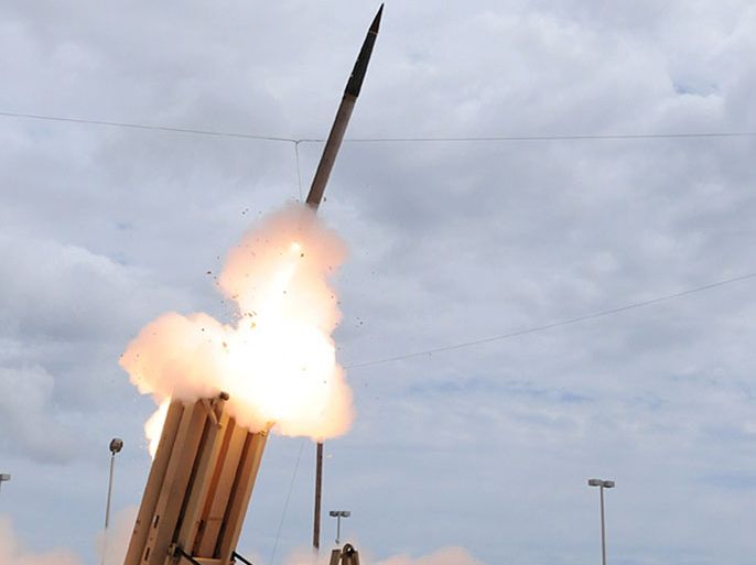 (FILES) This March 18, 2009 handout image courtesy of the US Missile Defense Agency shows the launch of the Terminal High Altitude Area Defense (THAAD) missile during a test. The United States is to deploy a THAAD missile defense battery to defend its bases on the Pacific island of Guam, the Pentagon said on April 3, 2013 following threats from North Korea. The news that the ground-based system would be in place in the coming weeks came after two Aegis anti-missile destroyers were sent to the western Pacific to intercept any North Korean strike against US or allied targets. The THAAD (Terminal High Altitude Area Defense) is a truck-mounted system that can pinpoint an enemy missile launch, track the projectile and launch an interceptor to bring it down. = RESTRICTED TO EDITORIAL USE - MANDATORY CREDIT " AFP PHOTO / US MISSILE DEFENSE AGENCY/" - NO MARKETING NO ADVERTISING CAMPAIGNS - DISTRIBUTED AS A SERVICE TO CLIENTS =