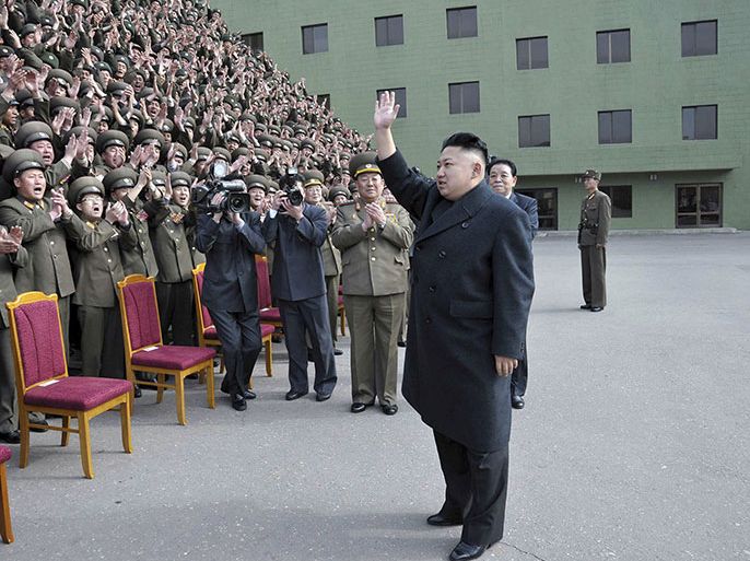 This photo taken on March 28, 2013 and released by North Korea's official Korean Central News Agency (KCNA) on March 29, 2013 shows North Korean leader Kim Jong-Un (C) during a photo session with the participants in the meeting of information workers of the whole army in Pyongyang. The White House said Friday it took a new warning from North Korea that it was in a state of war with South Korea seriously, but said Pyongyang's threats were following a familiar pattern. THIS PICTURE WAS MADE AVAILABLE BY A THIRD PARTY. AFP CAN NOT INDEPENDENTLY VERIFY THE AUTHENTICITY, LOCATION, DATE, AND CONTENT OF THIS IMAGE. THIS PHOTO IS DISTRIBUTED EXACTLY AS RECEIVED BY AFP. AFP PHOTO / KCNA via KNS