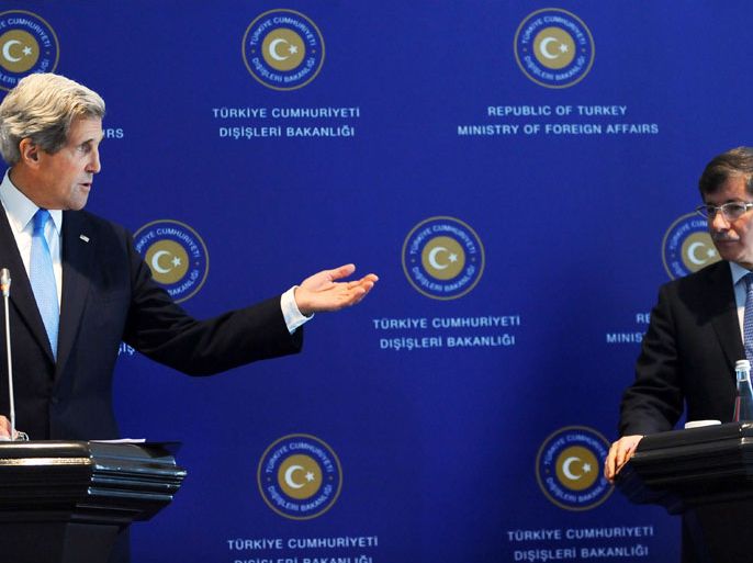 : US Secretary of State John Kerry (L) speaks during his press conference with his Turkish counterpart Ahmet Davutoglu on April 7, 2013 in Istanbul. Kerry arrived on April 7 in Turkey to discuss Syria's civil war and the Middle East peace process as well as to bolster the Turkish-Israeli rapprochement brokered two weeks ago by Washington