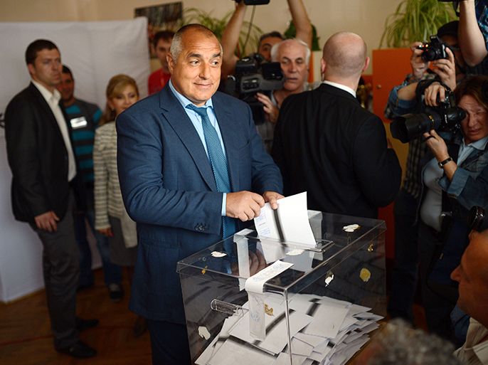 Boyko Borisov, the leader of the Bulgarian conservative GERB party and a former Prime Minister, casts his ballot at a polling station during the general election in Sofia on May 12, 2013. Bulgarians began voting in a tight and tense snap general election marred by accusations of fraud and expected to result in political stalemate and fresh protests in the EU's poorest member. AFP PHOTO / DIMITAR DILKOFF