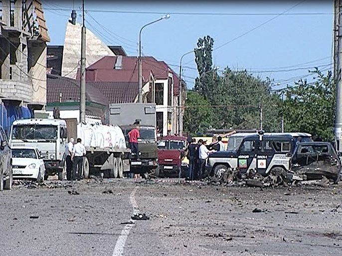A video grab made on May 20, 2013 shows a blast site outside a building used by court bailiffs in central Makhachkala. At least eight people were killed and more than a dozen injured today in twin car blasts outside a court building in the southern Russian city of Makhachkala in the restless region of Dagestan. AFP PHOTO / ACHMED ACHMEDOV