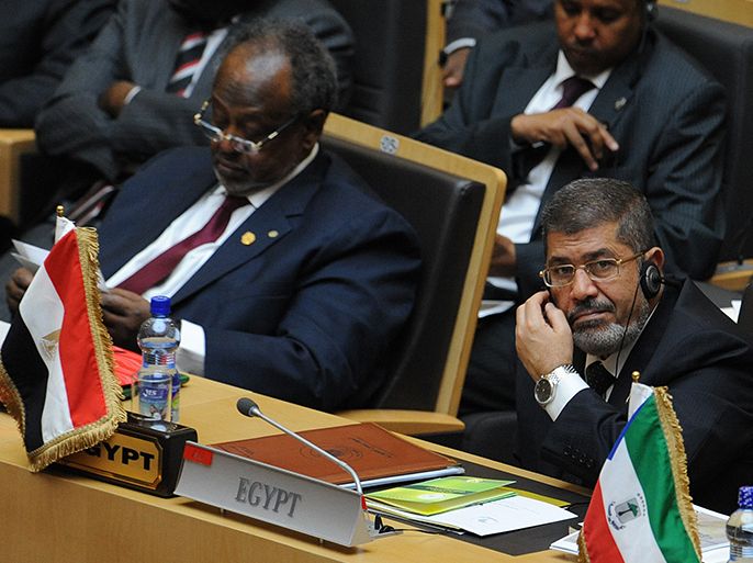 Egyptian President Mohamed Morsi (R) and his Djiboutian counterpart Mohammed Guelleh attend the 50th jubilee's ceremonies of the African Union, with Africa's myriad problems set aside for a day to mark the progress that has been made. AFP PHOTO/SIMON MAINA
