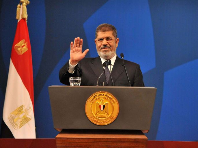 A handout picture released by Egyptian presidency shows Egyptian President Mohamed Morsi giving the opening speech of a conference organized by civil society groups on May 29, 2013 in the Egyptian capital, Cairo. Egypt's presidency said on May 28 that it will submit a proposed law regulating civil society groups to the senate, insisting it reflects the values of the country's democratic uprising despite accusations it is restrictive. AFP PHOTO / EGYPTIAN PRESIDENCY