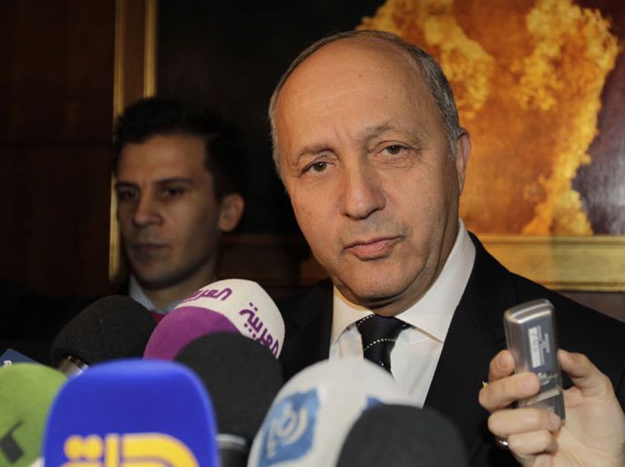 Amman, -, JORDAN : French Foreign Minister Laurent Fabius answers to journalists' questions as he arrives for the opening of the "Friends of Syria" meeting in Amman, Jordan on May 22, 2013. The gathering seeks to discuss US-Russian proposal to hold a peace conference dubbed "Geneva 2" to bring together rebels and representatives of Syrian President's regime. AFP PHOTO KHALIL MAZRAAWI
