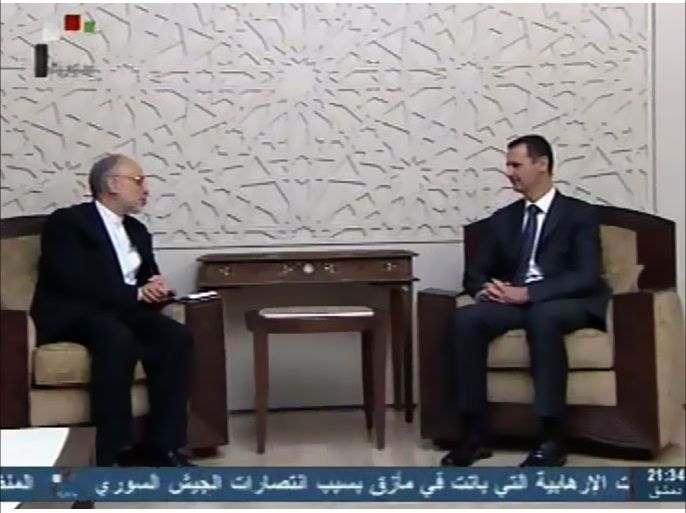 An image grab taken from the state-run Syrian television on May 7, 2013, shows Syrian President Bashar al-Assad (R) meeting with Iran's Foreign Minister Ali Akbar Salehi in Damascus. AFP PHOTO/HO/SYRIAN TV == RESTRICTED TO EDITORIAL USE - MANDATORY CREDIT "AFP PHOTO/SYRIAN TV - NO MARKETING NO ADVERTISING CAMPAIGNS - DISTRIBUTED AS A SERVICE TO CLIENTS ==