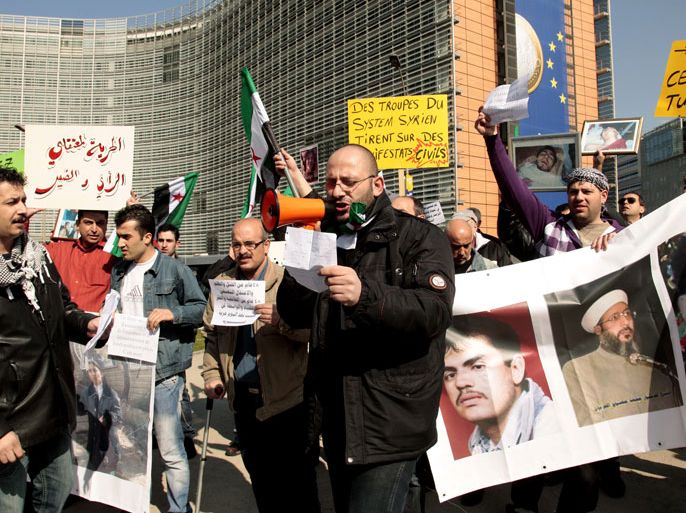 Syrian protesters demonstrate against Syrian President Bashar Assad in front of the European Commission headquarters in Brussels, Belgium, 28 March 2011. Recent demonstrations by reformers and supporters of Syrian President Bashar's government and the Baath Party have led to street violence and a growing number of dead and injured across Syria. EPA/OLIVIER HOSLET