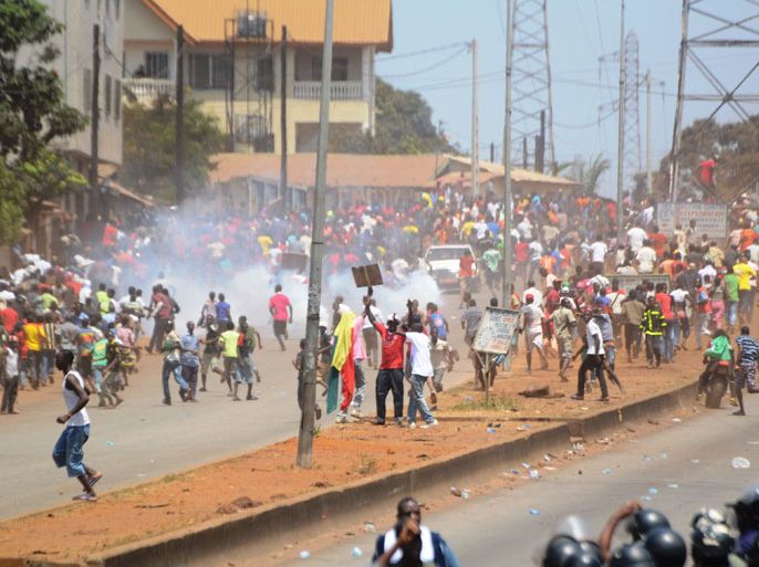 This file picture taken on February 27, 2012 shows thousands of people gathering during a demonstration to demand transparency in elections scheduled for May 12 and protest against the South African company selected to revise the electoral roll in Conakry. A man was shot dead and others were wounded on May 23, 2013 in Conakry, as fights broke out during an opposition march calling for transparency in the country's upcoming presidential election