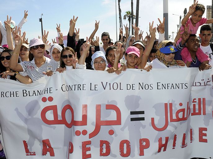 Moroccans gather during a demonstration against child sexual abuse in Casablanca on May 5, 2013, after a harrowing assault last month left a nine-year-old girl near-dead. Last month the child Wiam was found unconscious in a pool of blood by her 6-year-old brother after a neighbour in a village of the Sidi Kacem region in northwest Morocco sexually abused her and beat her up, media reports said. AFP PHOTOS/FADEL SENNA
