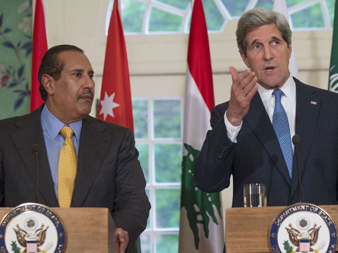 District of Columbia, UNITED STATES : US Secretary of State John Kerry makes a statement with Qatari Prime Minister Hamad bin Jassim Al Thani after a meeting with the Arab League at Blair House in Washington, DC, on April 29, 2013. AFP PHOTO/JIM WATSON