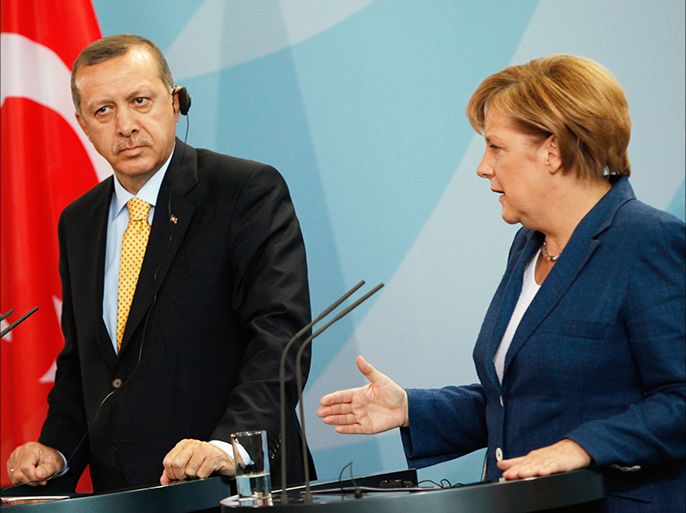 (FILES) - Picture taken on October 9, 2010 shows German Chancellor Angela Merkel and Turkish Prime Minister Recep Tayyip Erdogan addressing a press conference at the chancellory in Berlin. German Chancellor Angela Merkel's conservative party on June 24, 2013 reiterated, in its election programme, its long-standing opposition to Turkey joining the European Union.In comments that came amid heightened tensions between Berlin and Ankara, Merkel also said the goal of a "privileged partnership" between Turkey and the bloc had been reworded because Turkey did not want it. AFP PHOTO / DAVID GANNON